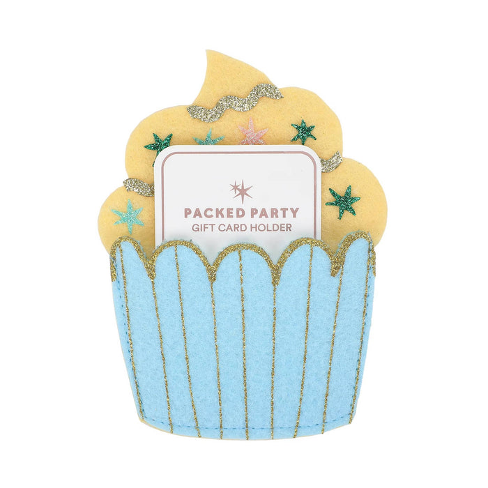 A cupcake-shaped felt gift card holder with a light blue wrapper, yellow frosting, and small glitter star accents, holding a white gift card that reads 'PACKED PARTY GIFT CARD HOLDER' on a plain white background.