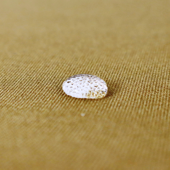 This WPC-Lite is a yellowish-brown color. This photo shows a water drop on the fabric.