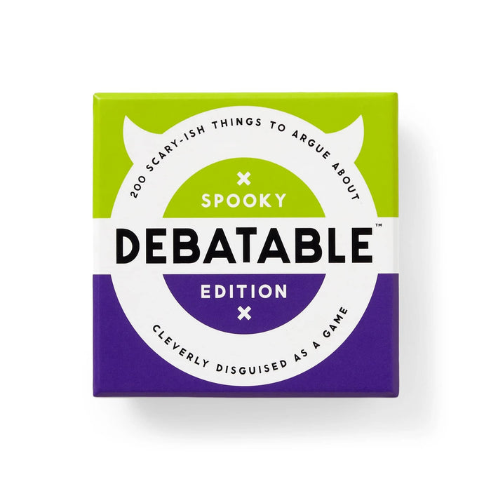 The game box for 'Debatable Spooky Edition' is shown against a plain white background. The box features a split design with a bright lime green top half and a deep purple bottom half, divided by a large white circular graphic.