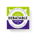 The game box for 'Debatable Spooky Edition' is shown against a plain white background. The box features a split design with a bright lime green top half and a deep purple bottom half, divided by a large white circular graphic.