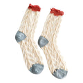 A pair of cream-colored cable-knit socks with coral ruffled cuffs and light blue heels, toes, and soles, displayed against a solid white background.