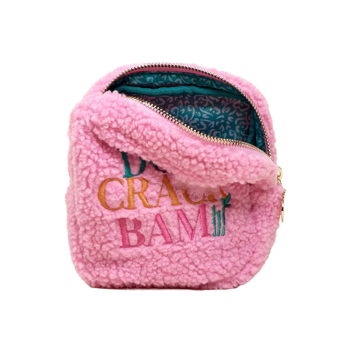 Square pink fleece pouch unzipped to show the green wipeable lining on the interior, on a white background.