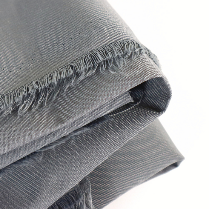 This ReNew Solid is in a standard neutral shade of grey with a cool undertone. This photo is of the fabric folded.