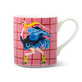 A white ceramic mug featuring a pink and red grid pattern with an illustration of an ostrich with yellow leopard-print boot roller skates with the text 'DRAMATIC EXIT', handle is on the right and it's on a white background.