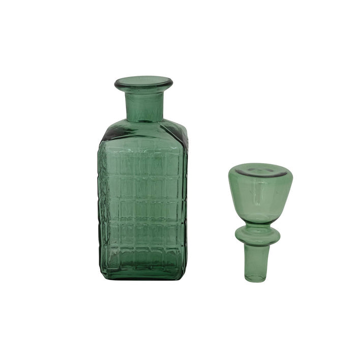 A dark green textured glass decanter with a matching green glass stopper, displayed on a clean white background.