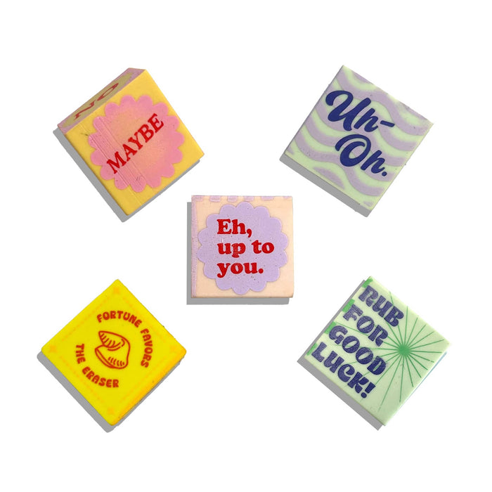 Ooly Feeling Lucky dice-shaped erasers, set of 5 in assorted colors with sayings on them, on a plain white background.