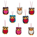 Set of colorful felt owl-shaped ornaments with heart details on a white background.