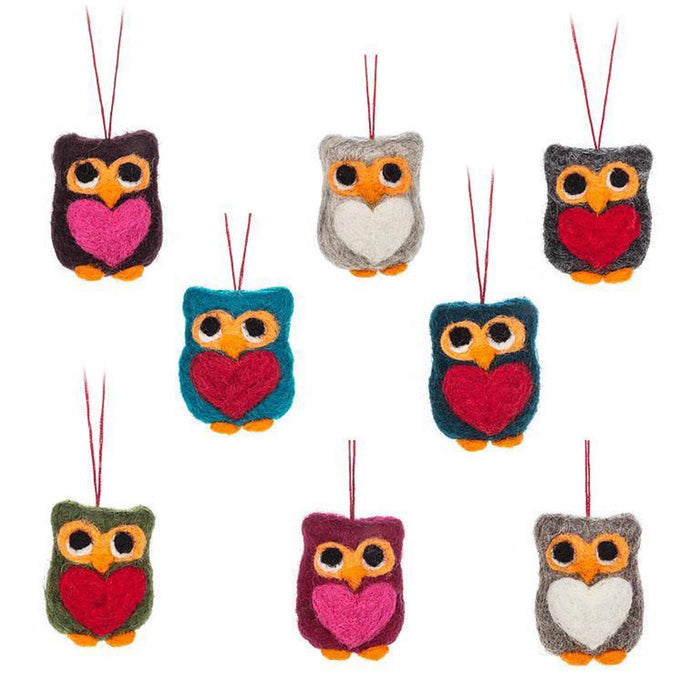 Set of colorful felt owl-shaped ornaments with heart details on a white background.