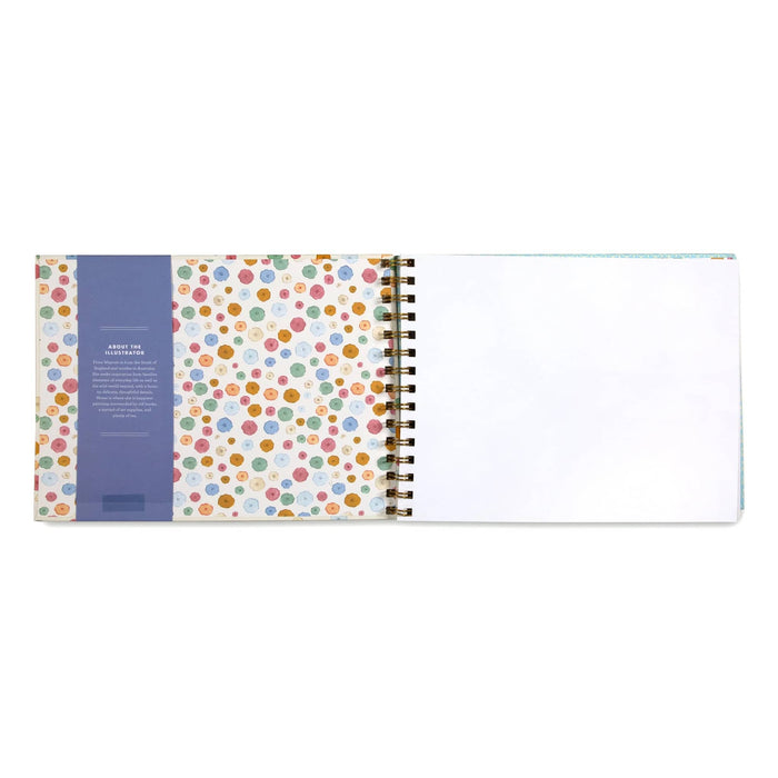 Spiral-bound sketchbook with colorful polka dot design on the inside cover.