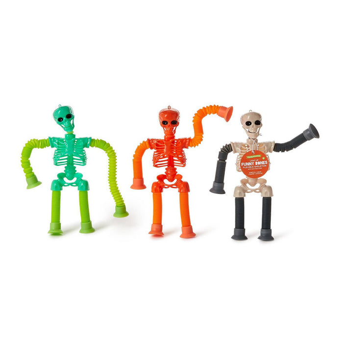 Three flexible plastic toy skeletons in green, orange, and beige, each with collapsible limbs and a small round accessory on their skulls, displayed against a plain white background.