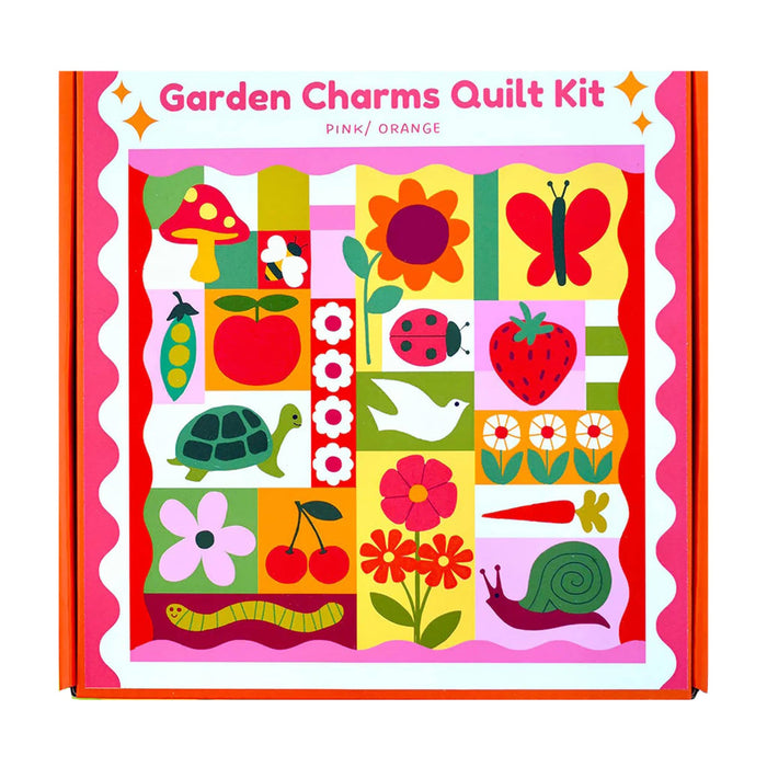 Garden Charms Quilt Kit packaging with colorful quilt design and text.