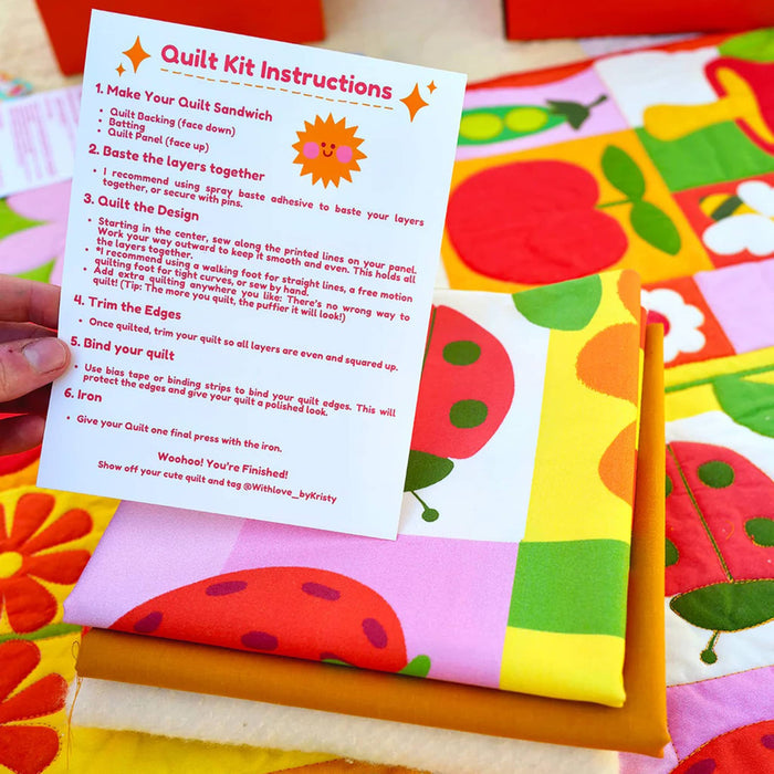 Colorful quilt kit with instructions.