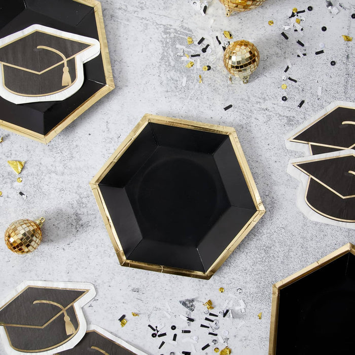 CR Gibson black hexagon shaped paper party plate with gold trim in a graduation party table setting.