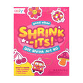 Ooly Good Vibes Shrink-Its! DIY Mini Shrink Art Kit box, featuring a bright pink cover with colorful cartoon illustrations of a daisy, disco ball, mushroom, bus, and cherries, along with age 6+ and warning text.