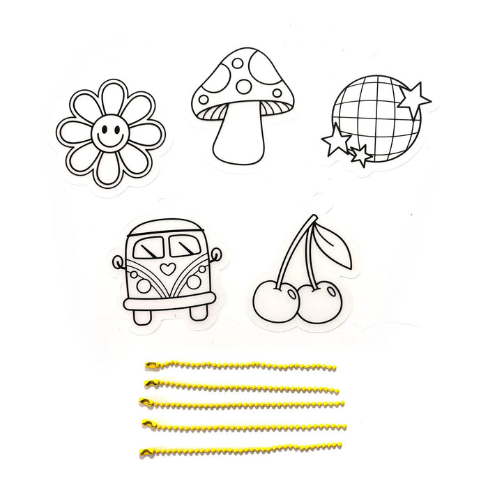 5 black and white charms with yellow bead chains on a plain white background.