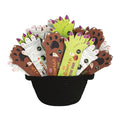 A black woven basket filled with Halloween-themed tattoo books in 3 styles, werewolf paw, mummy hand, and monster hand, set against a plain white background.