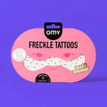 Pack of heart-shaped rose gold freckle tattoos with 'omny' branding on a purple background.