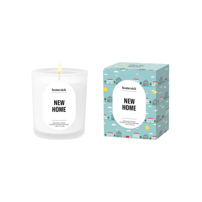 Homesick 'New Home' mini candle with illustrated blue box packaging on a white background.