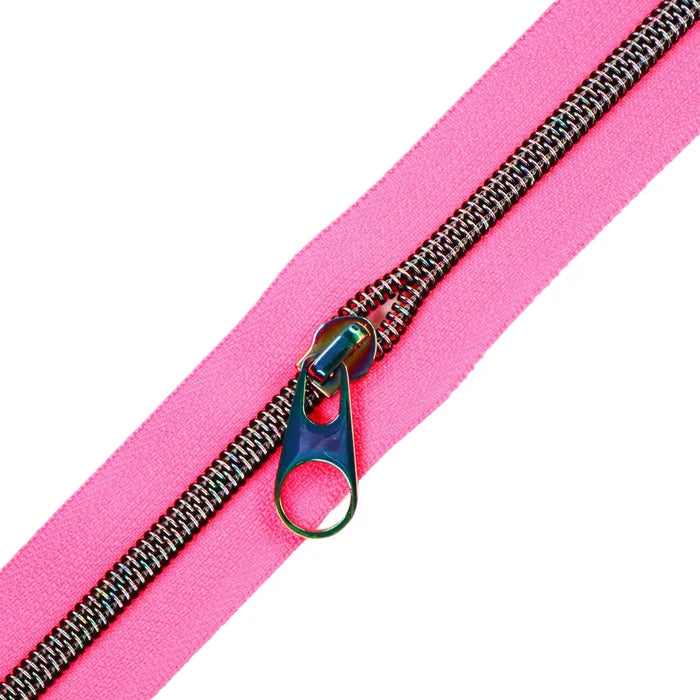 A very bright and fluorescent hot pink zipper tape with midnight rainbow coil teeth with a pop tab pull.