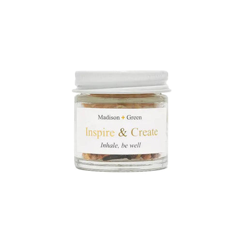 Inspire and Create aromatherapy inhaler in a glass jar, front view, on a white background.