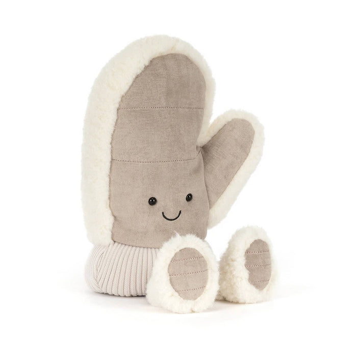 A plush winter mitten toy in a warm taupe-brown fabric with cream sherpa trim, featuring a simple embroidered smiley face and small feet, front angle view, shown on a clean white background.