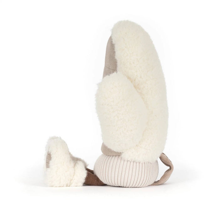 A plush winter mitten toy in a warm taupe-brown fabric with cream sherpa trim and small feet, side view, shown on a clean white background.