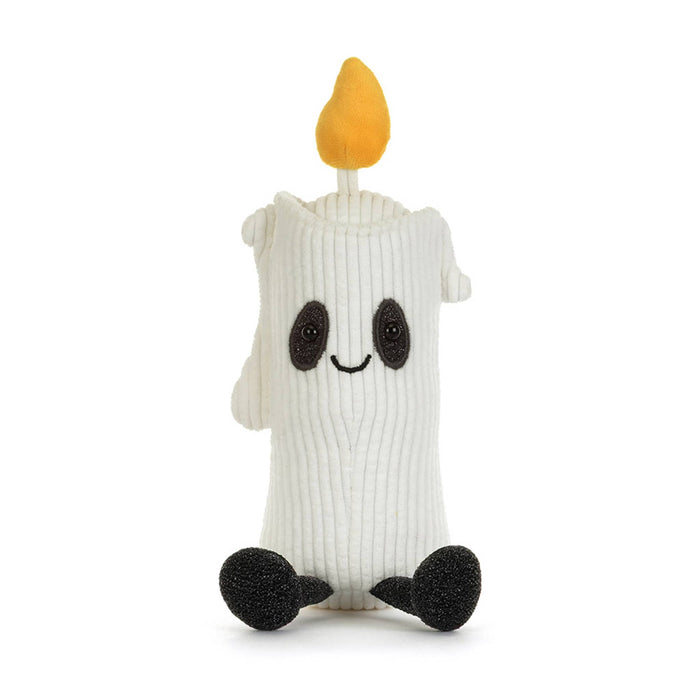A white corduroy ghost candle plush toy with a yellow-orange flame on top, black embroidered eyes and mouth, and black feet, front view, shown on a plain white background.