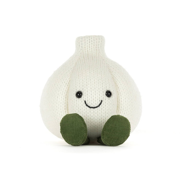 A knitted garlic plush toy in off-white with olive green corduroy feet and a simple embroidered smiley face, front view, shown on a clean white background.