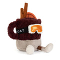 A plush toy shaped like a mulled spiced drink in a mug with a smiling face, wearing orange ski goggles and brown boots, front angle view, on a solid white background.