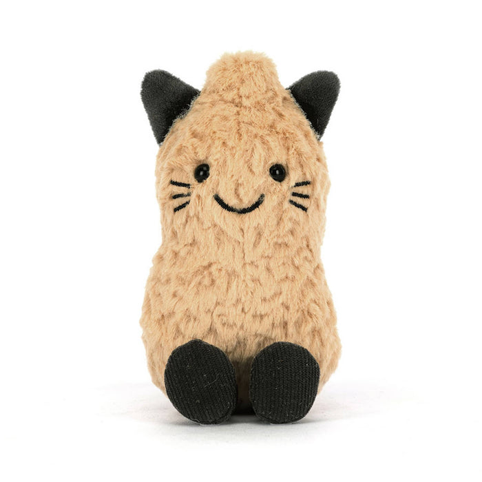 A plush peanut toy in a warm beige/tan color with black cat ears, paws, whiskers, and tail, front view, sitting against a plain white background.