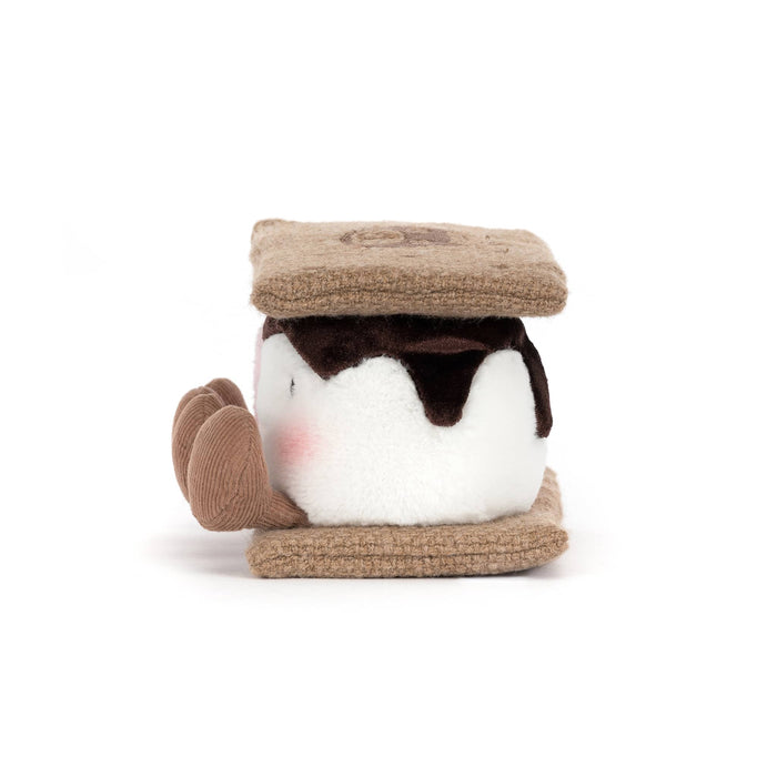 Plush toy resembling graham crackers with pink and white marshmallows with chocolate, side view, on a white background.