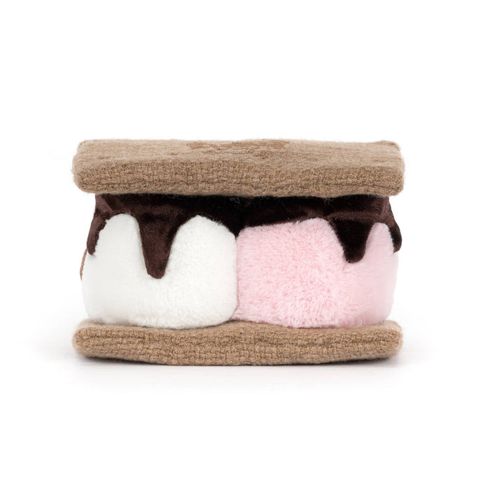 Plush toy resembling graham crackers with pink and white marshmallows with chocolate, back view, on a white background.