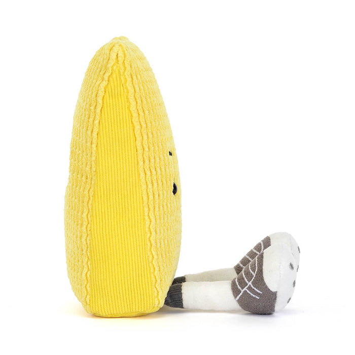 Soccer yellow card plush toy with a raised eyebrow and smile, side view, on a white background.
