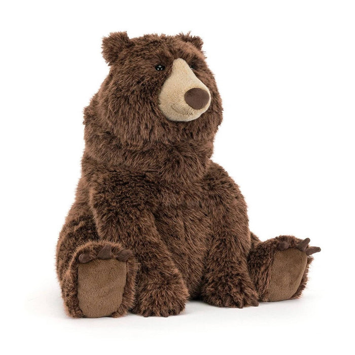 A brown plush stuffed bear toy sitting upright, front angle view on a clean white background.