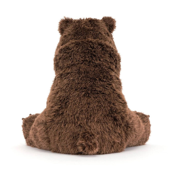 A brown plush stuffed bear toy sitting upright, back view on a clean white background.