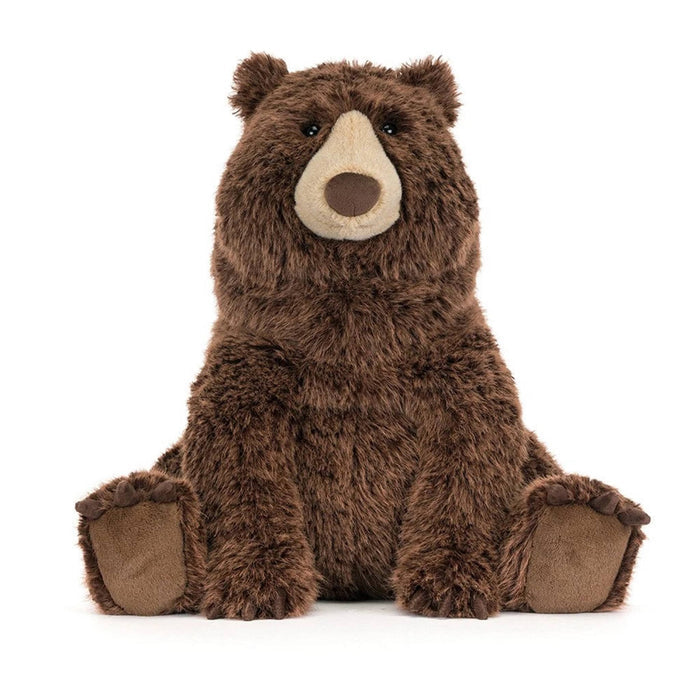 A brown plush stuffed bear toy sitting upright, front view on a clean white background.