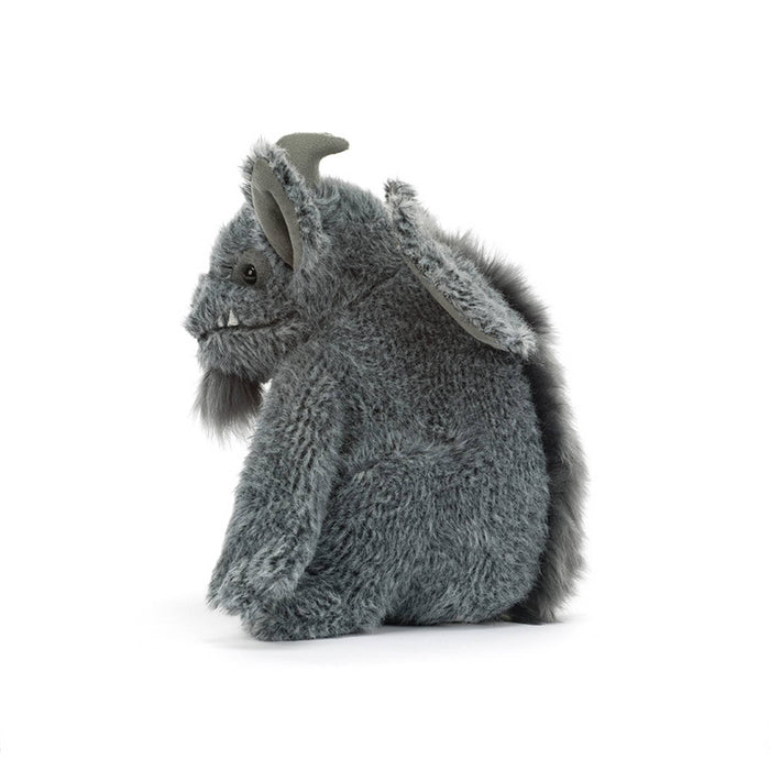 A gray plush gargoyle toy with large pointed ears, small horns, and a stitched smiling face, side view, against a clean white background.
