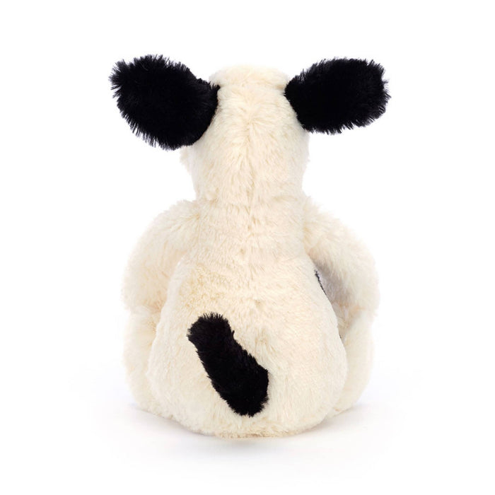 Jellycat bashful black & cream puppy small plush toy, back view, on a white background.