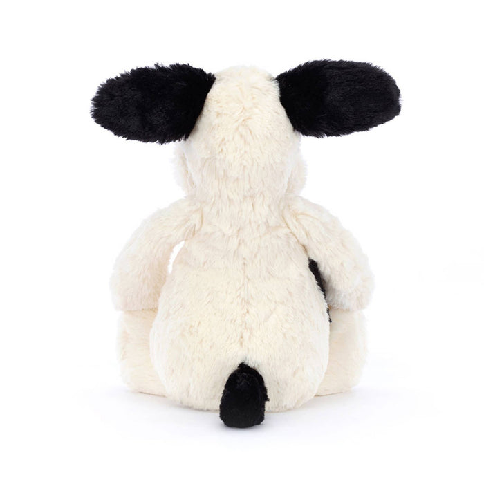 Jellycat Medium Bashful Rufferty black and cream puppy plush toy, back view on a white background.