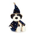 A plush dog toy dressed as a wizard, featuring a navy blue velvet robe and pointed hat with gold star patterns and trim, front angle view, against a plain white background.