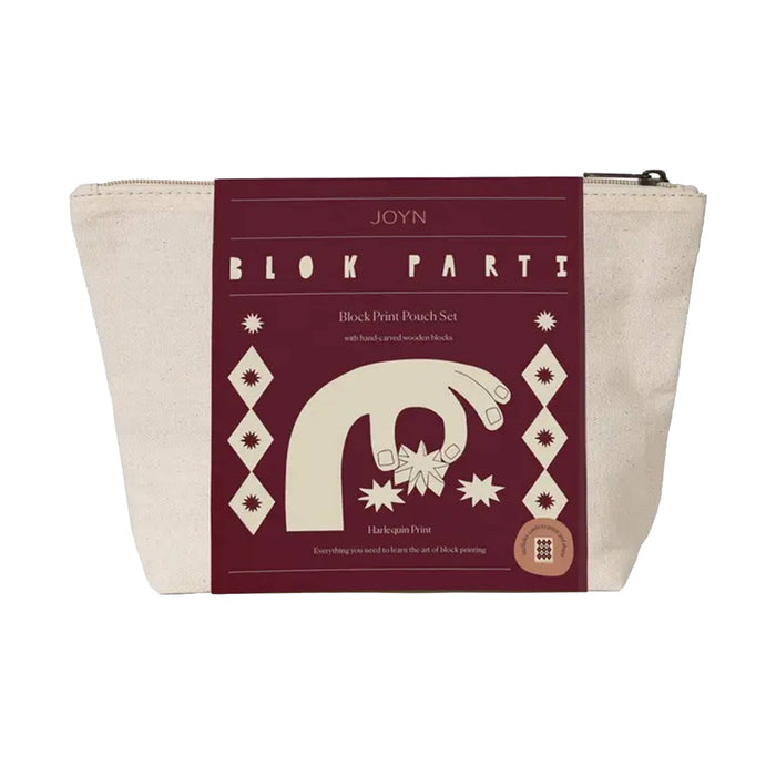 Front of JOYN Blok Parti Harlequin Block Printing Pouch Set, featuring an off-white canvas pouch with burgundy bellyband with cream-colored block printing illustrations of hands, diamonds and star patterns, on a plain white background.