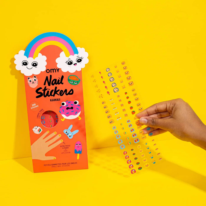 Nail stickers with packaging on a yellow background.