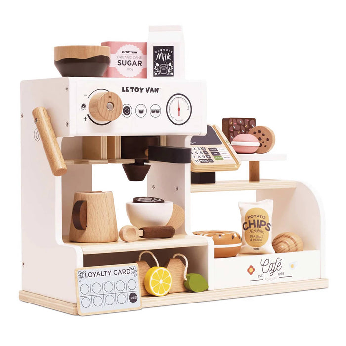 Wooden toy coffee machine set with accessories on a white background.