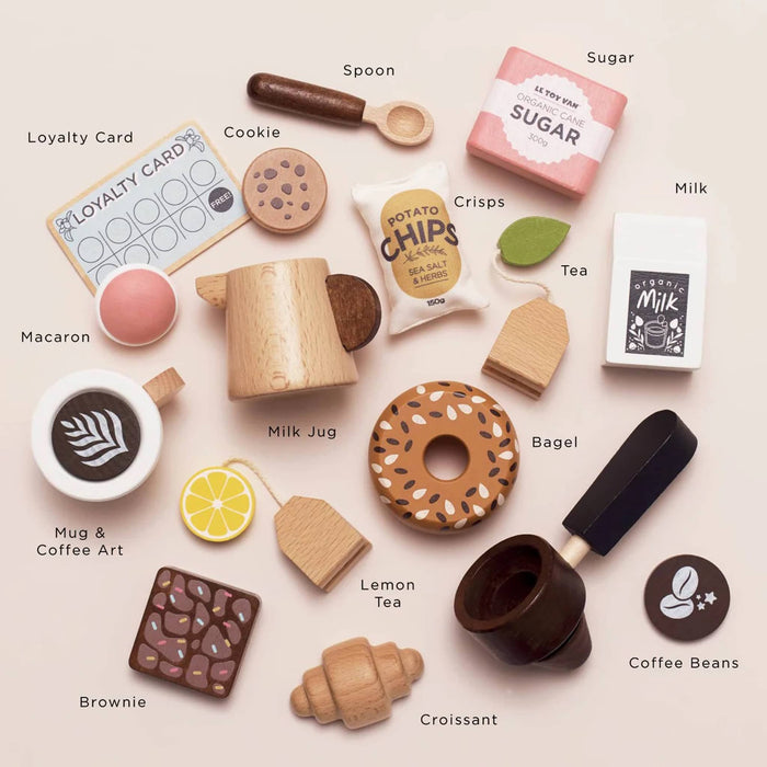 Collection of toy food items and utensils with labels on a light pink background.
