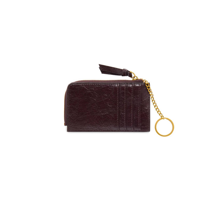 Back of a dark brown faux leather zip-around card holder wallet with a gold chain and keyring, card slots, and a brown leather zip pull tag, shown on a plain white background.