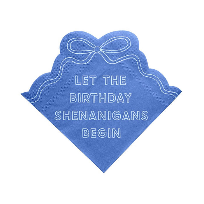 Blue napkin with bow design and "Let the birthday shenanigans begin" in white, on a white background.