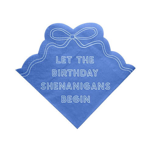 Blue napkin with bow design and "Let the birthday shenanigans begin" in white, on a white background.