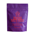 A purple stand-up pouch of Lookout and Wonderland Hinoki Bath Soak, featuring orange-red text and logo on a white background.