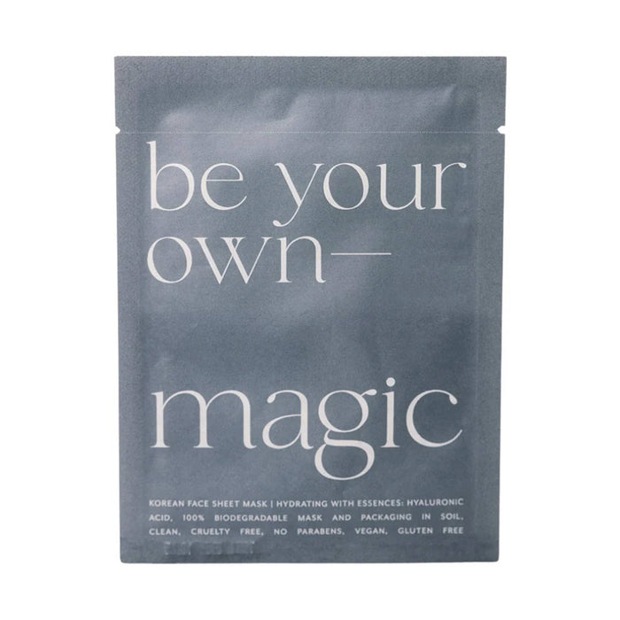A single flat sheet mask packet in a dark slate blue color with white text reading 'be your own- magic' on a plain white background.