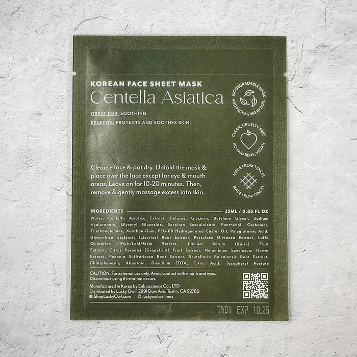 A single Centella Asiatica Korean Face Sheet Mask packed in an olive green pouch, placed on a textured white wall.